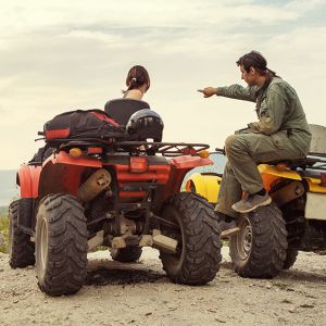 Man and woman on ATVs